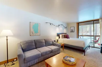 a living room with a couch and a bed at Aspen Grove Hideaway in Truckee