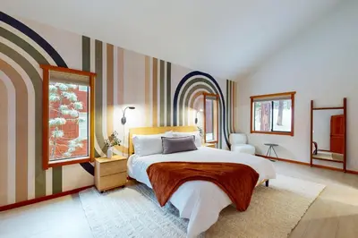 a bedroom with a large bed and a window at Sierra Solstice in Truckee