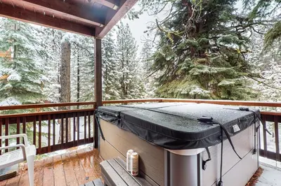 a hot tub on a deck in the snow at Sierra Solstice in Truckee