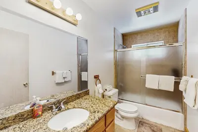 a bathroom with a sink and a toilet and a shower at Fawn Lodge in Tahoe Vista