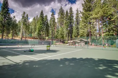 a tennis court with two tennis rackets on it at Northstar Original Village Studio One in Truckee