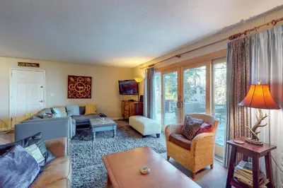 a living room with a couch and a table at West Shore Lakeview Beauty* in Homewood