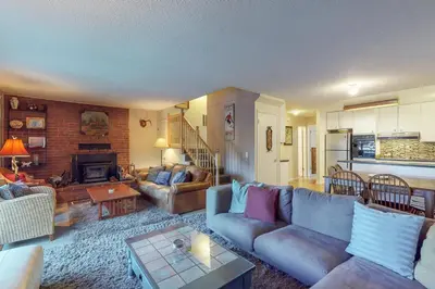 a living room with a couch and a table at West Shore Lakeview Beauty* in Homewood