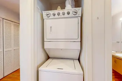 a white stove in a kitchen with a sink at Christy Lane Condo in Olympic Valley