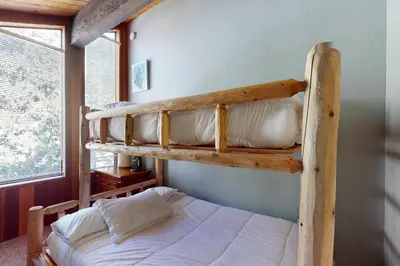 a couple of bunk beds in a bedroom at Nordic Retreat in Kings Beach
