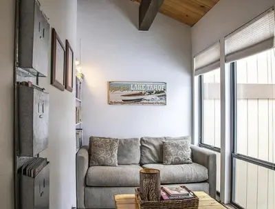 a living room with a couch and a table at Streamside Townhome in Kings Beach