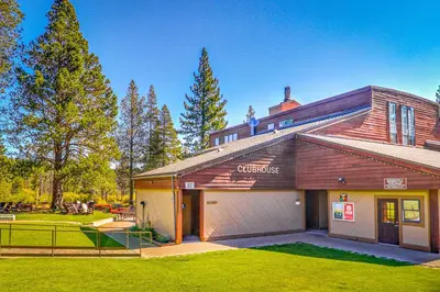 a house with a garage in a yard at Solvang Family Getaway in Truckee