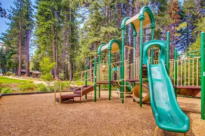 a playground with a slide in a park at View Condo at Northstar in Truckee