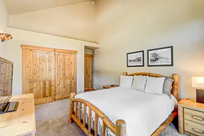 a bedroom with a large bed and a desk at Stockholm Luxury Retreat in Truckee