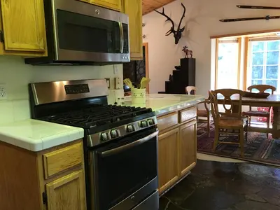a kitchen with a stove top oven in a kitchen at Kingswood Estate Cabin Retreat in Kings Beach