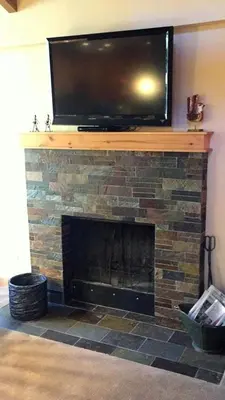 a fireplace with a flat screen tv on top of it at 114 Premium Condo in Mammoth Lakes