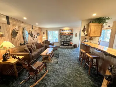 a living room with a couch and a fireplace at 141 Premium Condo in Mammoth Lakes