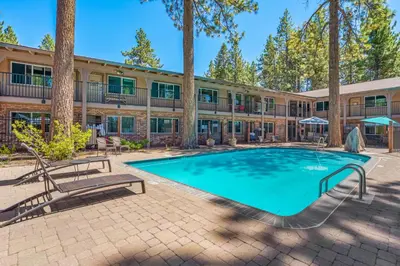 a swimming pool in front of a building at The Lodge at Lake Tahoe in South Lake Tahoe