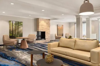 a living room with a couch and a fireplace at Fairfield Inn & Suites by Marriott Reno Sparks in Sparks
