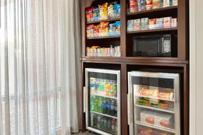 a refrigerator filled with lots of drinks and a microwave at Fairfield Inn & Suites by Marriott Reno Sparks in Sparks