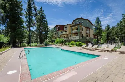 a swimming pool in front of a building at Mammoth Green # 105 in Mammoth Lakes