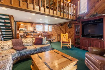 a living room with a couch and a coffee table at Snowcreek # 320 - Phase II in Mammoth Lakes