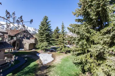 an aerial view of a resort with a river and trees at Snowcreek # 320 - Phase II in Mammoth Lakes