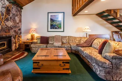 a living room with a couch and a coffee table at Snowcreek # 320 - Phase II in Mammoth Lakes