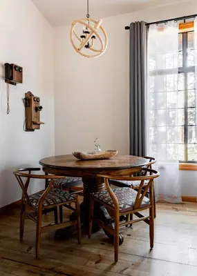 a dining room with a wooden table and chairs at Black Bear Lodge in South Lake Tahoe