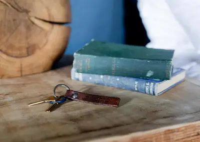 a pair of keys on a table next to a book at Black Bear Lodge in South Lake Tahoe