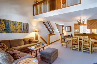 a living room with a couch and a table at Silver Strike at Northstar in Kingswood Estates