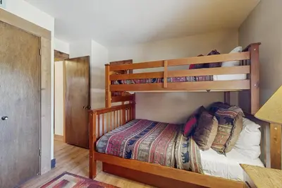 a bedroom with two bunk beds in a house at Silver Strike at Northstar in Kingswood Estates