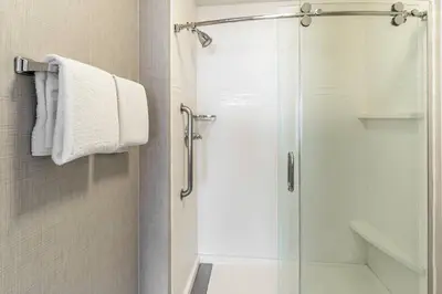 a shower with a glass door in a bathroom at Residence Inn Sacramento Rancho Cordova in Rancho Cordova