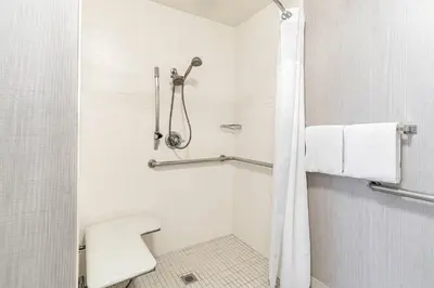 a bathroom with a shower and a toilet at Residence Inn Sacramento Rancho Cordova in Rancho Cordova