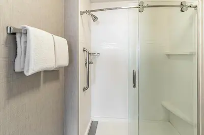 a shower with a glass door in a bathroom at Residence Inn Sacramento Rancho Cordova in Rancho Cordova