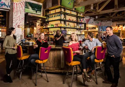 a group of people sitting at a bar at Circus Circus Reno, A Caesars Destination in Reno
