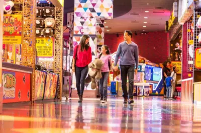 a group of people walking down a shopping mall at Circus Circus Reno, A Caesars Destination in Reno