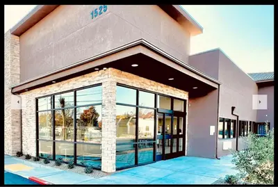 a store front with large windows in a building at Ramada by Wyndham Modesto Yosemite Area in Modesto
