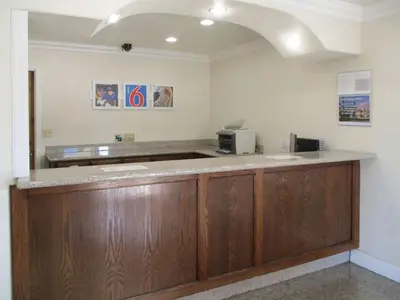 a waiting room with a cash register and a counter at Motel 6-Fresno, CA in Fresno