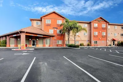 an empty parking lot in front of a building at La Quinta Inn by Wyndham Livermore in Livermore