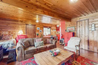 a living room with a couch and a table at The Cherry Leaf Lodge & Retreat on Fallen Leaf Lake in Fallen Leaf