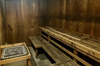 a wooden bench and a cage in a room at Woodlands 34 in Mammoth Lakes