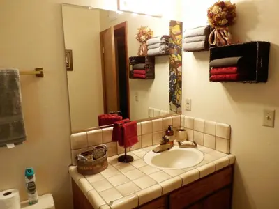 a bathroom with a sink and a mirror at NEW CHARMING 2 BEDROOMS UNIT CLOSE TO EVERYTHING in Oakhurst