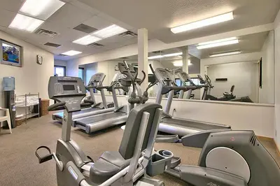 a gym with a lot of treadmills and machines at South Lake Tahoe Resort - Steps to Beach & Close to Heavenly in South Lake Tahoe