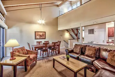 a living room with a couch and a dining room at South Lake Tahoe Resort - Steps to Beach & Close to Heavenly in South Lake Tahoe