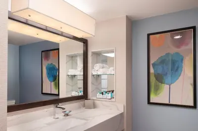 a bathroom with a sink and a large mirror at Grand Sierra Resort and Casino in Reno