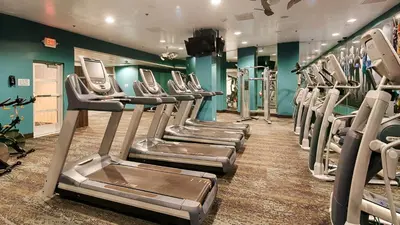 a gym with rows of tread machines in a room at Grand Sierra Resort and Casino in Reno