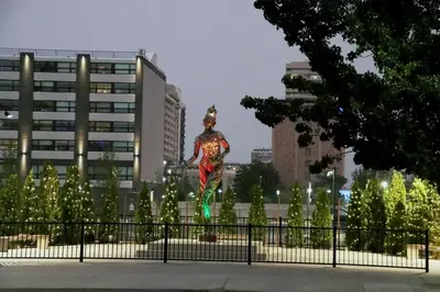 a statue of a woman standing on a fence at J Resort in Reno