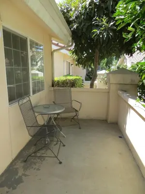 two chairs and a table on a patio at Garden Inn and Suites Fresno in Fresno