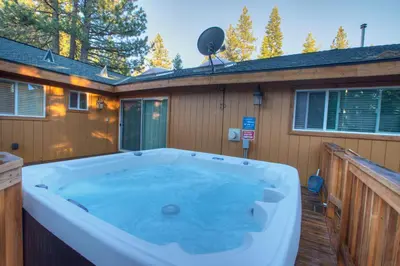 a jacuzzi tub on the side of a house at Prestigious Home South Lake Tahoe in South Lake Tahoe