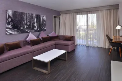 a living room with a couch and a table at Visalia Marriott at the Convention Center in Visalia