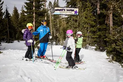 a group of people on skis in the snow at Mammoth Mountain Inn in Mammoth Lakes
