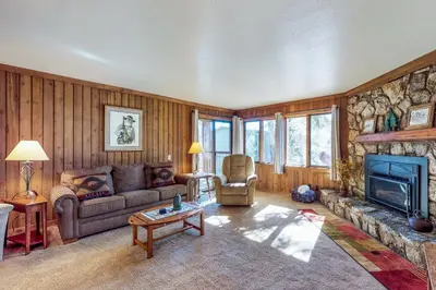 a living room with a couch and a fireplace at Mountainback 47 in Mammoth Lakes