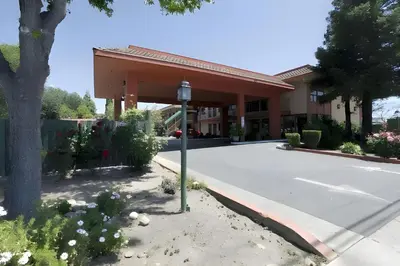 a parking lot in front of a building at Days Inn by Wyndham Gilroy in Gilroy