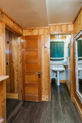 a bathroom with a sink and a mirror at Tamarack Lodge in Mammoth Lakes